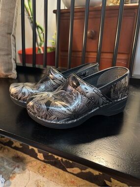 Dansko Black Clogs with Silver Floral Print